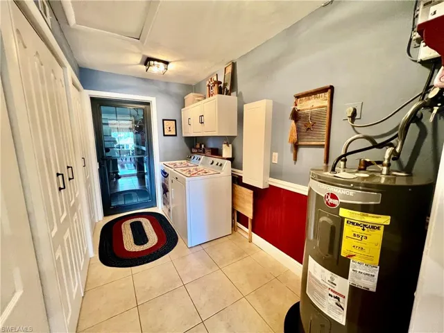 Indoor laundry room with plenty of storage.