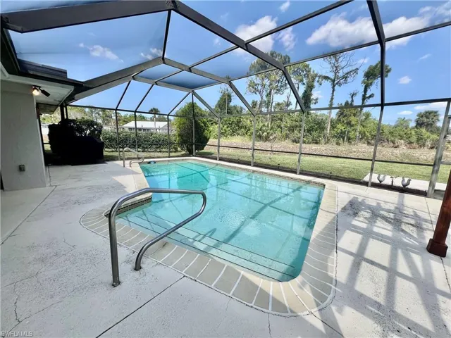 Screen enclosed in ground pool.