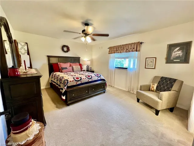 Primary bedroom with ensuite private bathroom with large walk in closet with build in shelving.