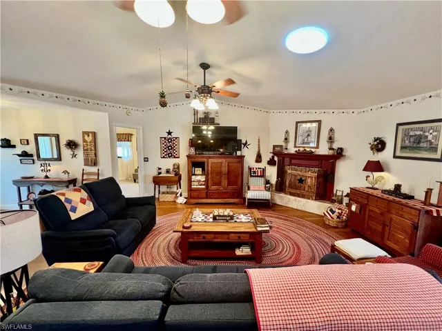 Living room with cathedral ceilings and skylight.