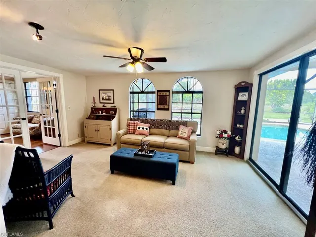 Extra living area in the family room overlooking the pool area.