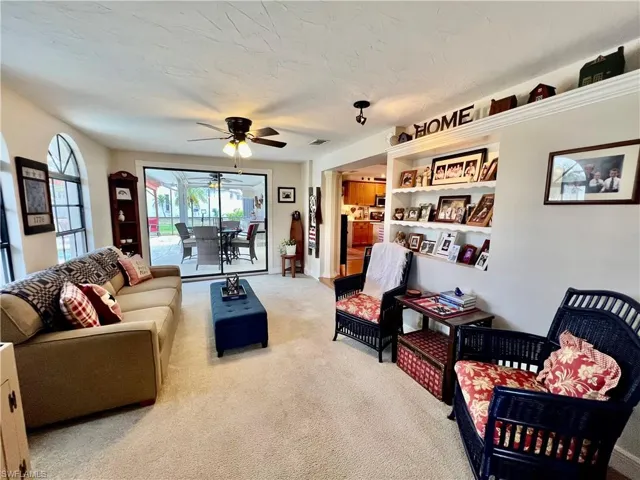 Extra living area in the family room with build in shelving.
