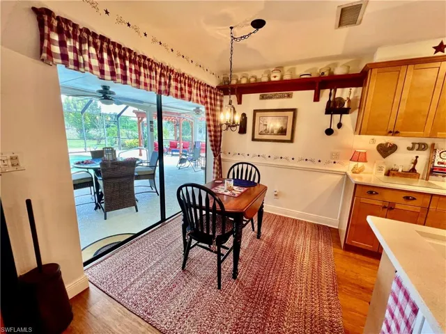 Dinette off of the kitchen overlooking the pool.