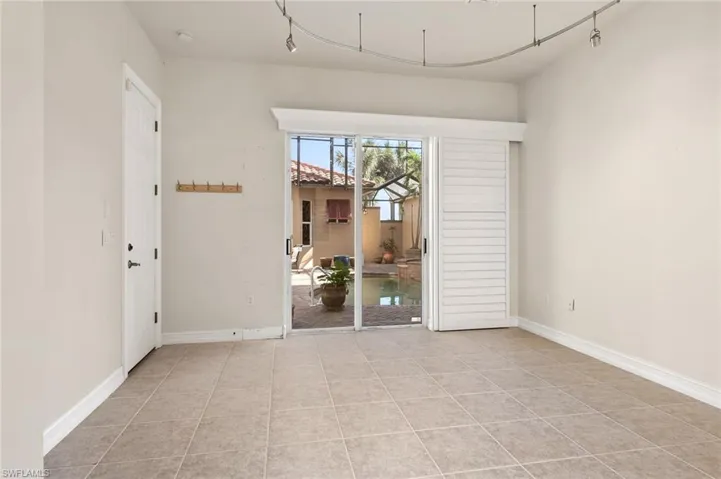 Empty room featuring light tile patterned floors