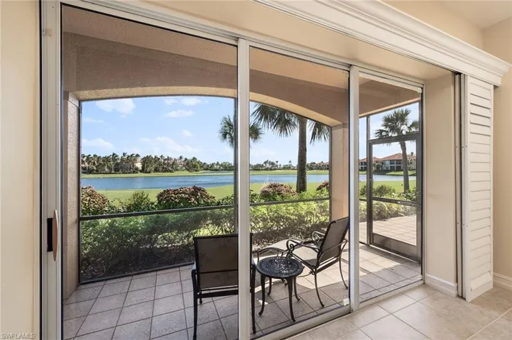 Unfurnished sunroom featuring a water view and a healthy amount of sunlight