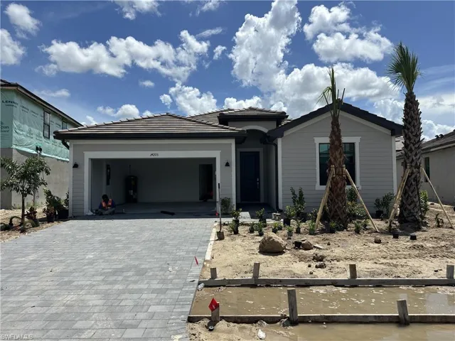 View of front of property featuring a garage