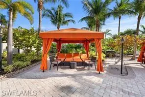 Surrounding community featuring a gazebo, an outdoor hangout area, and a patio