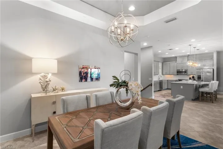 Dining area featuring a chandelier, recessed lighting, and baseboards