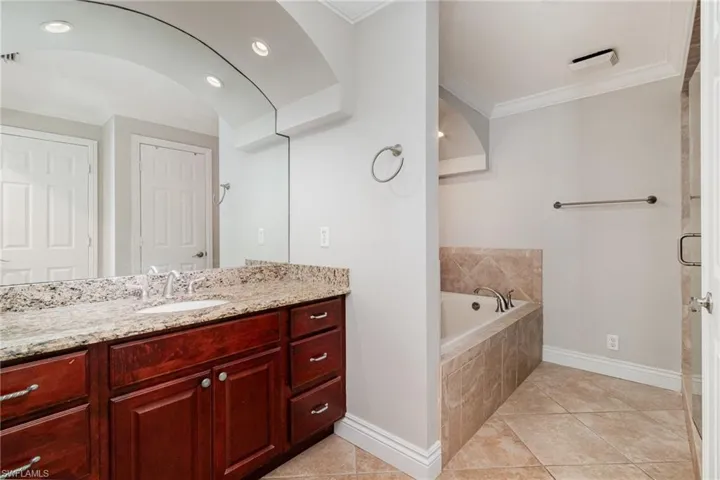 Apt "A" Master bath vaniety and tub.