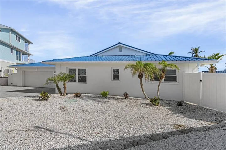 View of property exterior with a garage