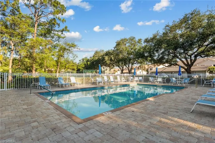 Pool featuring a patio and fence