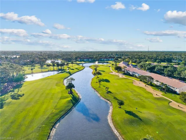 Bird's eye view with a water view and golf course view