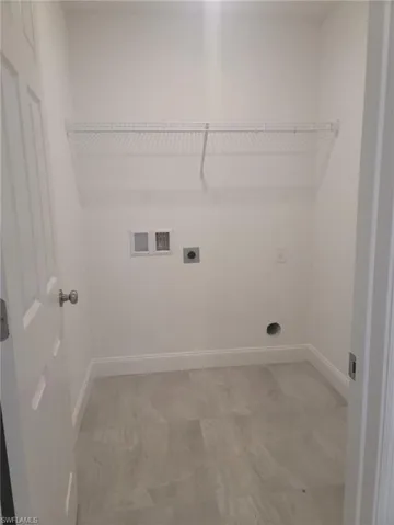 Laundry room with washer hookup and hookup for an electric dryer