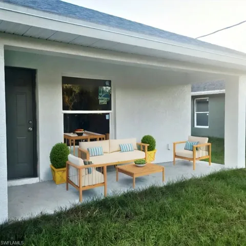 View of patio with an outdoor living space