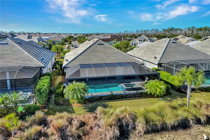 Aerial view of residential area featuring a pool