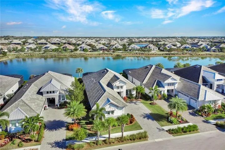 Aerial view of residential area featuring a large body of water