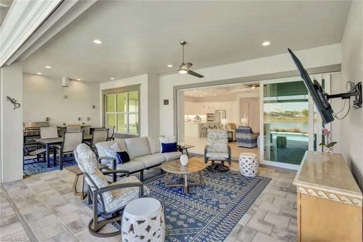 Living area with recessed lighting and a ceiling fan