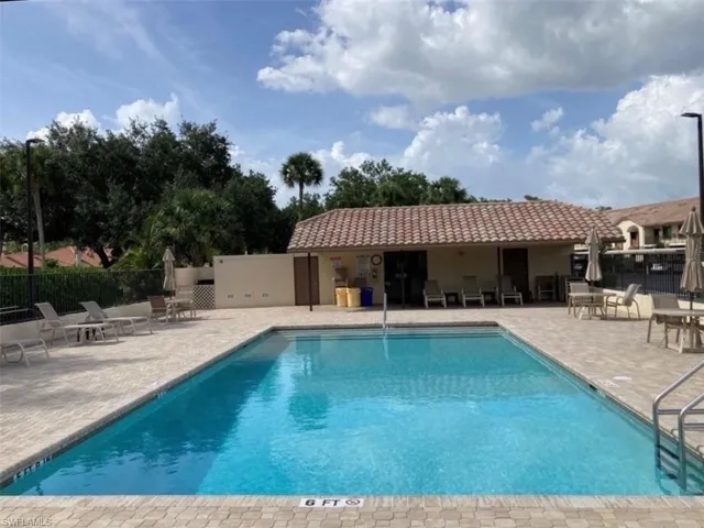 Community pool featuring a patio area
