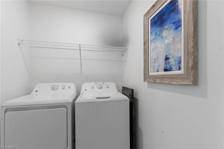 Laundry area featuring washer and clothes dryer