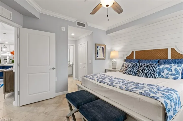 Bedroom with crown molding, a closet, a ceiling fan, and recessed lighting