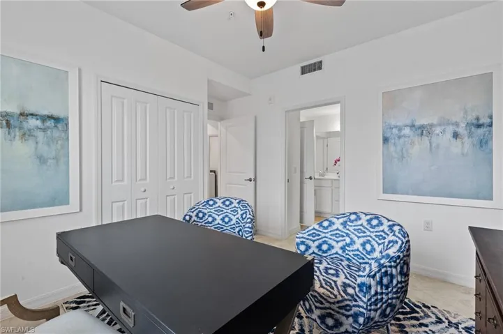 Office area with baseboards and a ceiling fan