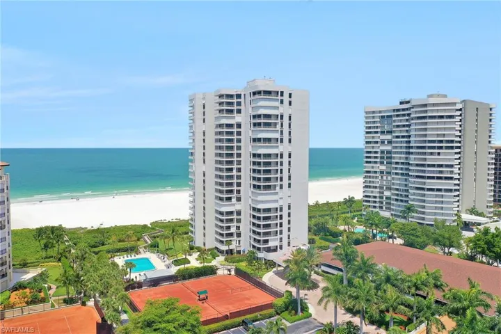Drone / aerial view with a view of the beach and a water view