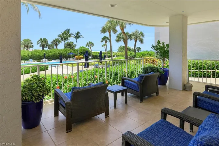 View of patio featuring a balcony