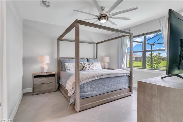 Tiled bedroom with ceiling fan