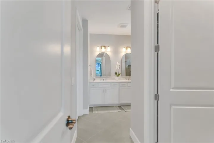Bathroom featuring vanity and tile patterned flooring