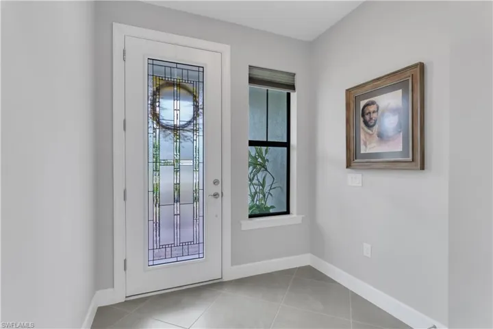 Entryway light tile patterned floors