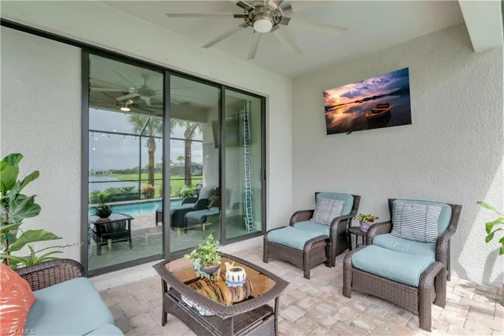 View of lanai with ceiling fan and TV
