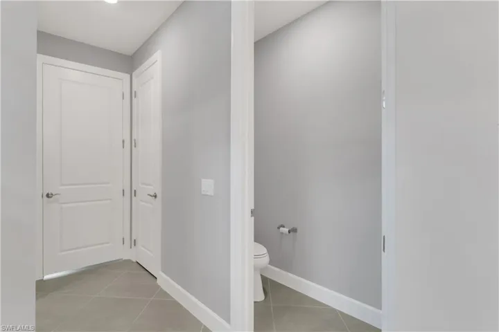 Bathroom with toilet and tile patterned floors