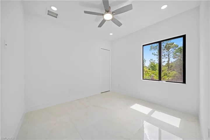 Bright room with large window showcasing natural scenery