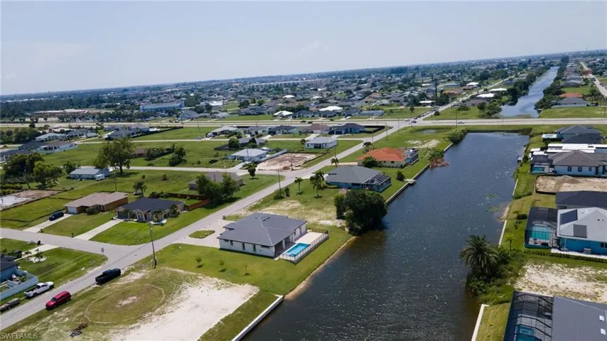 Aerial view with a water view and a residential view
