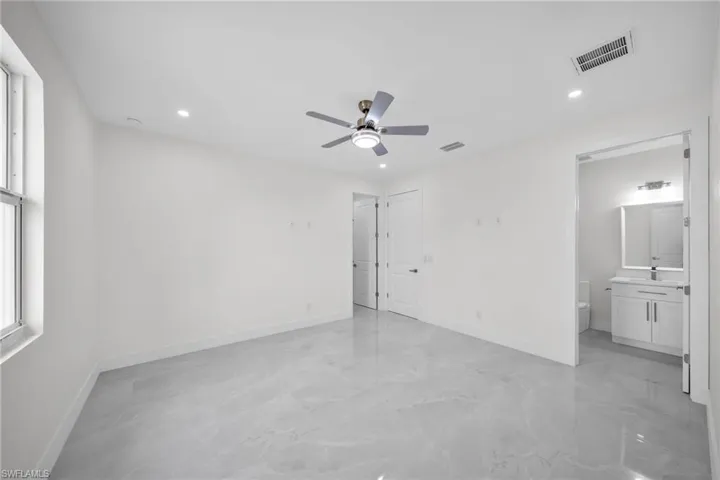 Unfurnished bedroom with recessed lighting, visible vents, and baseboards