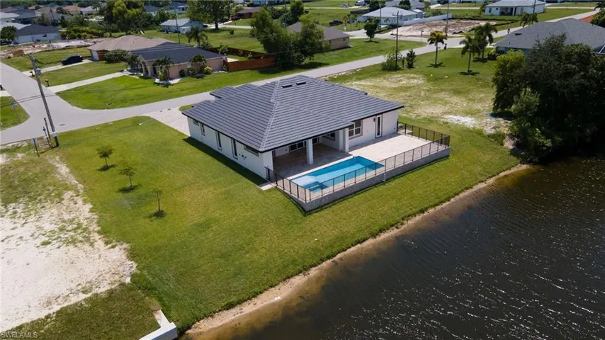 Drone / aerial view featuring a water view and a residential view