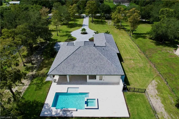 View of subject property with a pool area