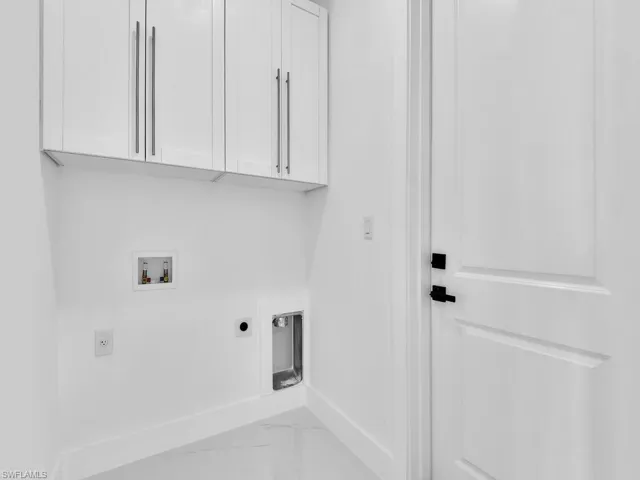 Laundry area with electric dryer hookup, cabinets, and washer hookup
