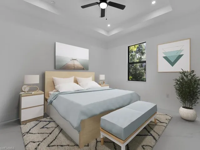 Tiled bedroom with ceiling fan and a raised ceiling