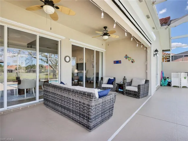 View of patio with a ceiling fan and outdoor lounge area
