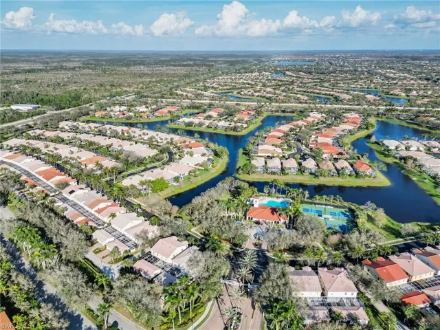 Aerial overview of property's location featuring nearby suburban area and a large body of water