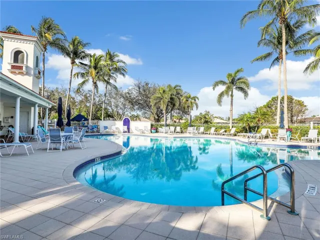 Community pool with a patio