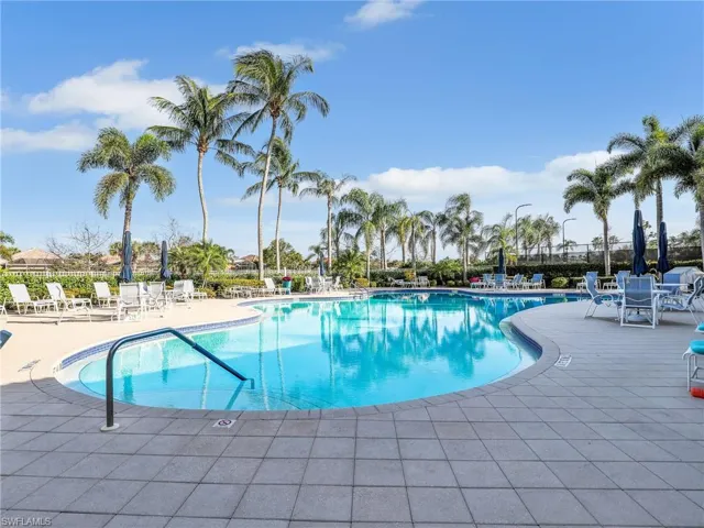 Community pool featuring a patio