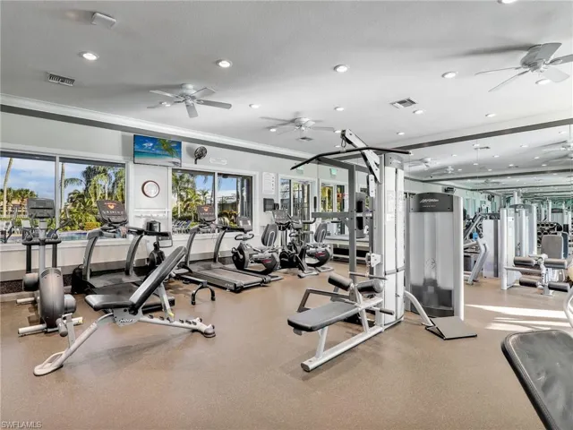Exercise room featuring ceiling fan and recessed lighting