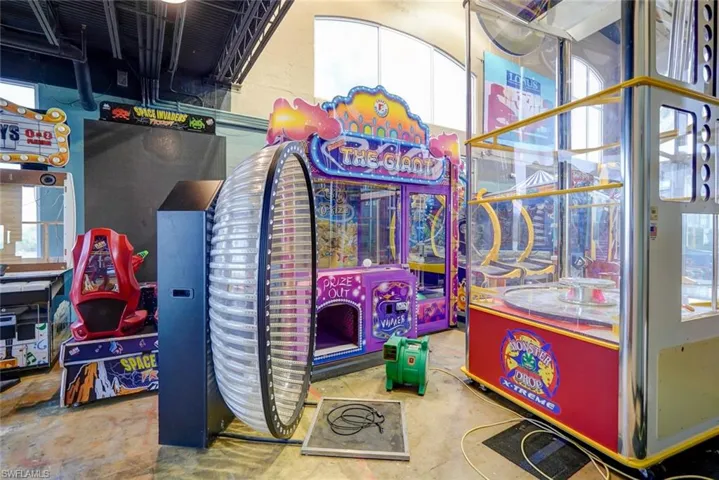 Game room with concrete flooring