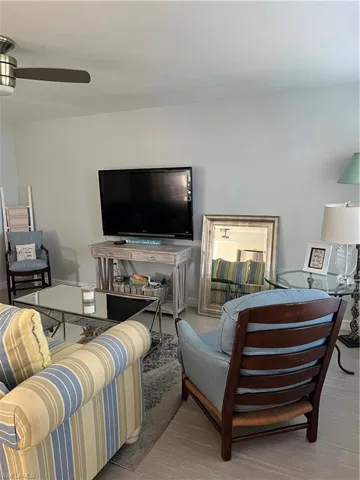 Living room featuring ceiling fan