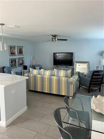 Living room featuring ceiling fan