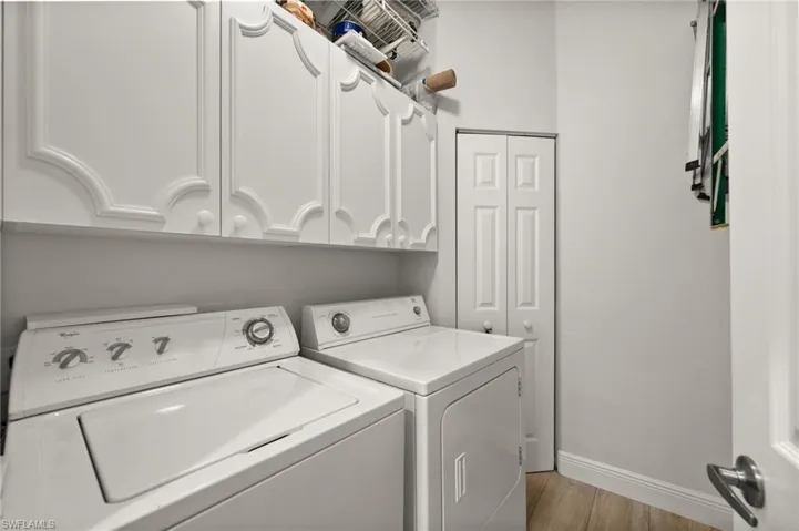 Spacious laundry room with ample storage space.
