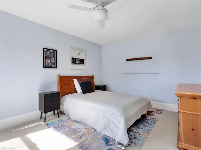 Bedroom featuring carpet and a ceiling fan