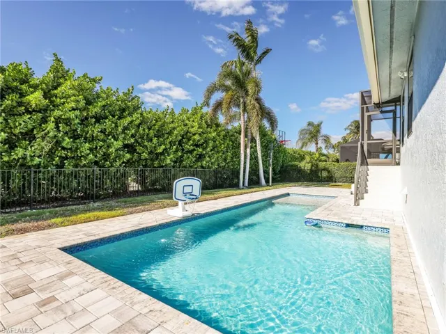 View of swimming pool featuring a patio area and a fenced backyard